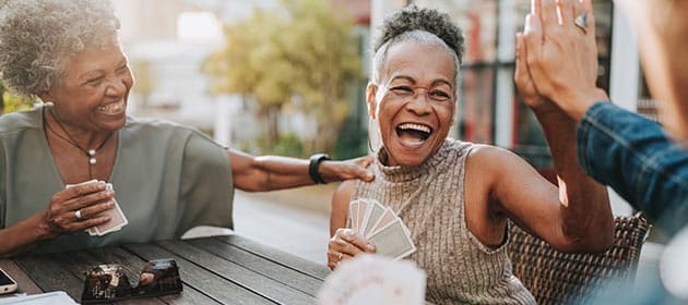 seniors enjoying a game of cards